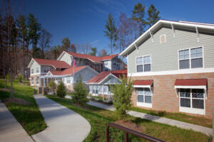 Apartment building with sidewalks and landscaping in front