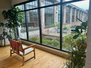 Chair looking out window at courtyard