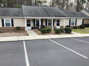 One story apartment building with a parking lot