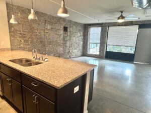 Kitchen and Living room with exposed brick and large windows