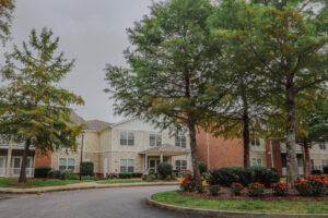 Two story apartment buildings with landscaping in bloom