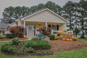 A one story building with fall landscaping