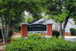 The brick entrance building to Woodbridge Apartments