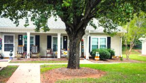 Single story apartment with covered porch