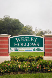 Wesley Hallows apartment complex sign