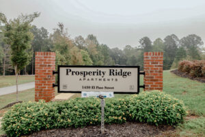 The brick entrance sign to an apartment communtiy