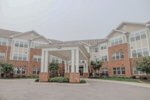 The front entrance to a three story apartment building