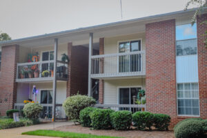 A two story apartment building with brick