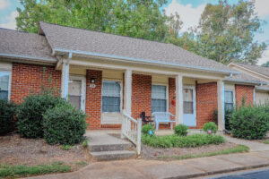 Brick one story building with covered porch