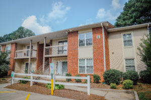 Two story building with covered porch off of each unit