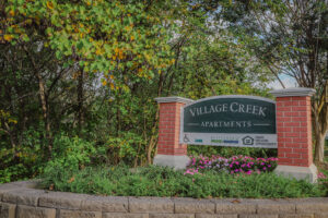 Village Creek apartment complex sign