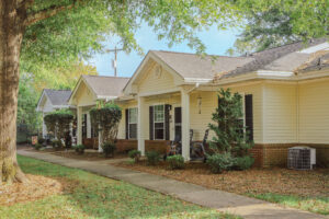 Single story apartment buildings with covered porch