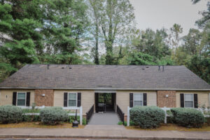 Apartment complex with trees behind