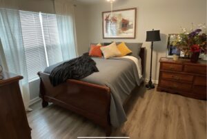 Apartment unit bedroom with large windows