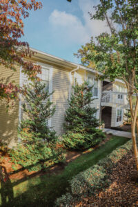 Two story apartment complex with mature landscaping