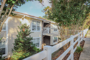 Two story apartment complex with mature landscaping