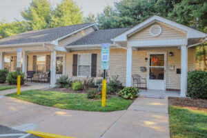 Single story apartment with paved walkways and handicap parking spots