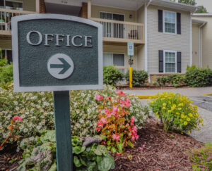 Sign pointing to the apartment community office