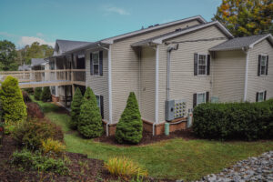 Two story apartment complex with landscaping