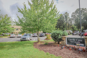 Linville Cove apartment complex sign and parking lot