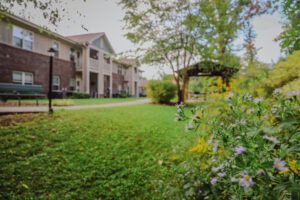 Landscaping and flowers outside of a two story apartment complex