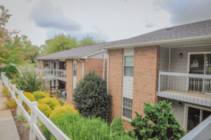 Two story apartment complex with landscaping