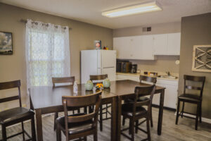 Community kitchen with table and seating