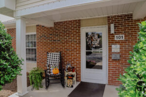 Porch with rocking chair and fall decorations