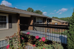 Two story apartment complex with roses