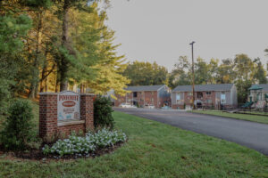 The entrance to a brick apartment community