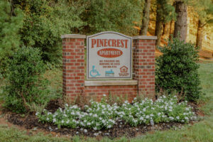 The brick entrance sign to an apartment communtiy