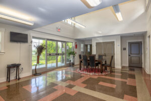 Apartment entryway with tile floor and table and chairs for seating