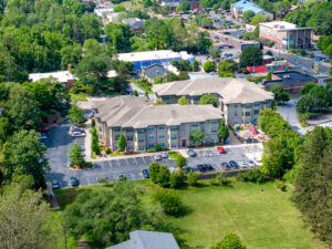 Birdseye view of apartment complex and parking lot