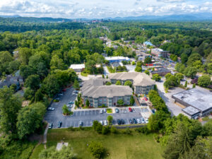 Birdseye view of apartment complex and parking lot