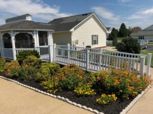 A one story apartment building with blooming landscaping