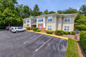 Apartment building with landscaping and trees