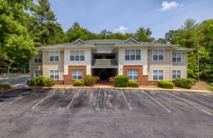 Apartment building with landscaping and trees