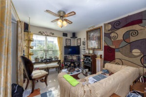 Living Room with large window and ceiling fan