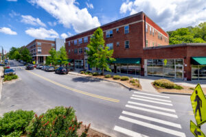 Brick building with shops on ground floor and apartments on the second and third floor