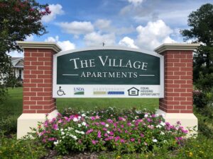 The Village Apartments Sign