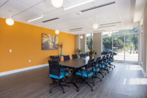 Community room with large table and chairs for meetings