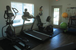 Exercise room with workout machines and equipment