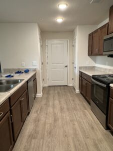 Kitchen with brown cabinets and stainless-steel appliances