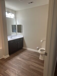 A bathroom vanity and toliet