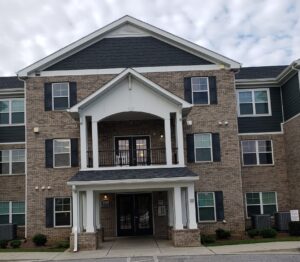 A three story apartment brick building