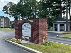 Brick entrance sign for New Legacy Apartments