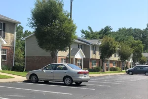 Apartment Complex with car parked in front