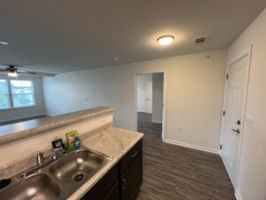 A kitchen that is open to the living room