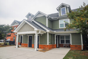 Green two story apartment complex