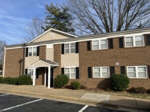 A two story brick building apartment building